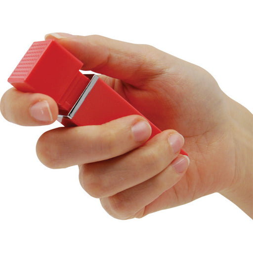Hand pulling top of lipstick alarm to activate 90dB siren showing ease of one-handed operation