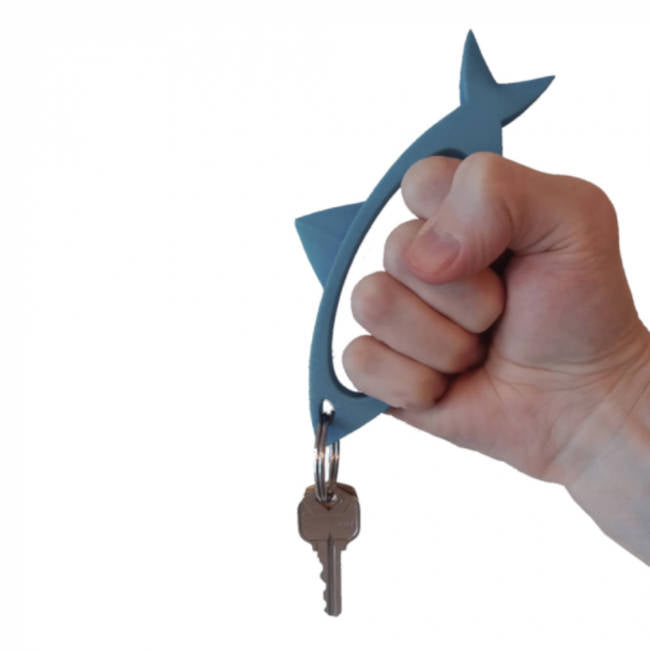 Shar-Key self defense keychain shark shaped blue in hand