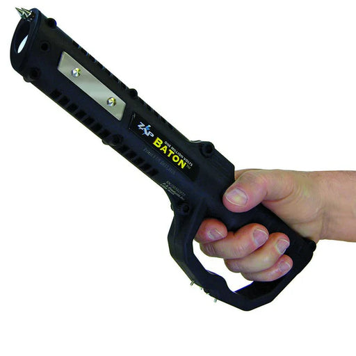 Hand gripping ZAP Baton stun gun demonstrating pistol grip handle guard and natural hold position