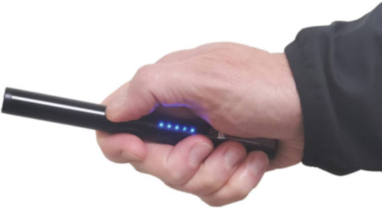 Holding the Pain Pen Stun Device