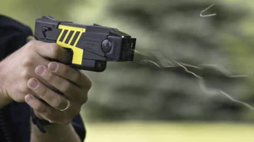 Police Office Shooting a TASER device